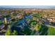 Panoramic aerial view of the community with lush golf course, lakes, and manicured landscaping, offering a luxurious lifestyle at 10562 Cerotto Ln, Las Vegas, NV 89135