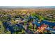 Expansive aerial view capturing the community's diverse amenities, including pools, lakes, and meticulously manicured landscapes at 10562 Cerotto Ln, Las Vegas, NV 89135