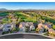 Aerial view of the golf course community showing beautiful desert landscaping and mountain views at 10562 Cerotto Ln, Las Vegas, NV 89135
