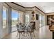 Elegant dining area with ornate furniture, plenty of sunlight and outside views at 10562 Cerotto Ln, Las Vegas, NV 89135