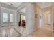 Grand entrance foyer with tile flooring and views into the dining room and hallway at 10562 Cerotto Ln, Las Vegas, NV 89135
