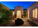 Inviting front entrance features double doors, a landscaped walkway, and a well-maintained exterior at 10562 Cerotto Ln, Las Vegas, NV 89135