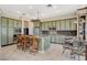 Spacious kitchen with stainless steel appliances, ample counter space, and seating at the island at 10562 Cerotto Ln, Las Vegas, NV 89135
