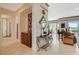 Comfortable living room with elegant furnishings, natural light, and views of the surrounding landscape at 10562 Cerotto Ln, Las Vegas, NV 89135