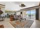Inviting living space featuring a large window with views of the golf course and an open floor plan at 10562 Cerotto Ln, Las Vegas, NV 89135