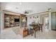 Bright living room with built-in bookshelves, decorative fireplace, and neutral decor at 10562 Cerotto Ln, Las Vegas, NV 89135