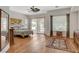 Bright main bedroom offering wood floors, an outside patio, and large windows at 10562 Cerotto Ln, Las Vegas, NV 89135