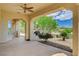 Inviting covered patio with outdoor dining area and peaceful golf course view at 10562 Cerotto Ln, Las Vegas, NV 89135