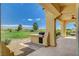 Charming covered patio with an outdoor kitchen and picturesque views of the golf course at 10562 Cerotto Ln, Las Vegas, NV 89135
