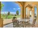 Inviting covered patio with stylish furniture, perfect for relaxing and enjoying golf course views at 10562 Cerotto Ln, Las Vegas, NV 89135