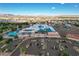 Panoramic aerial view of a school with modern facilities, ample parking, and surrounding cityscape at 1114 Junipine Ave, North Las Vegas, NV 89081