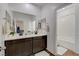 Bright bathroom featuring double sinks, white countertops and a shower and tub combo at 1114 Junipine Ave, North Las Vegas, NV 89081