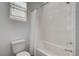 Bright bathroom featuring a shower and tub combination with white subway tile at 1114 Junipine Ave, North Las Vegas, NV 89081