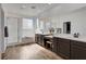 Bright bathroom features a shower and tub combination and double sinks at 1114 Junipine Ave, North Las Vegas, NV 89081