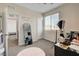 Bedroom with a leaning mirror, a large window, and a view into the closet at 1114 Junipine Ave, North Las Vegas, NV 89081