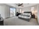 Spacious bedroom featuring a sliding glass door, a ceiling fan, and a king bed at 1114 Junipine Ave, North Las Vegas, NV 89081