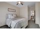 Cozy bedroom with plush carpet, ceiling fan, neutral colors, and comfortable furnishings at 1114 Junipine Ave, North Las Vegas, NV 89081