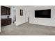 Spacious bonus room with plush carpeting, a built-in entertainment center, and plenty of natural light at 1114 Junipine Ave, North Las Vegas, NV 89081