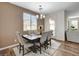 Cozy dining room featuring a stylish table, comfortable seating, and abundant natural light at 1114 Junipine Ave, North Las Vegas, NV 89081