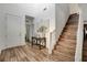 Welcoming foyer with hardwood flooring, a staircase, high ceilings, and an adjacent coat closet at 1114 Junipine Ave, North Las Vegas, NV 89081