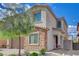 Attractive home exterior featuring stone accents, desert landscaping, and a well-maintained lawn at 1114 Junipine Ave, North Las Vegas, NV 89081