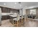 Modern kitchen with a large island, stainless steel appliances, and adjacent dining area at 1114 Junipine Ave, North Las Vegas, NV 89081