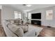 Spacious living room with comfortable seating, natural light, and entertainment center at 1114 Junipine Ave, North Las Vegas, NV 89081