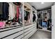 Organized walk-in closet with custom shelving, drawers, and ample storage for clothing and accessories at 1114 Junipine Ave, North Las Vegas, NV 89081