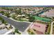 An aerial view of the neighborhood amenities including pool, tennis court, basketball court, park, and green spaces at 130 Twin Towers Ave, Las Vegas, NV 89123