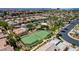 Aerial view of neighborhood amenities with basketball and tennis courts, green spaces and shade structures at 130 Twin Towers Ave, Las Vegas, NV 89123