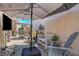 Cozy shaded patio with comfortable seating, perfect for relaxing outdoors at 130 Twin Towers Ave, Las Vegas, NV 89123