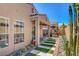 Landscaped backyard featuring an outdoor dining set at 130 Twin Towers Ave, Las Vegas, NV 89123
