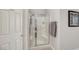 Bright bathroom features a glass-enclosed shower with built-in bench at 130 Twin Towers Ave, Las Vegas, NV 89123