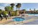 Relaxing jacuzzi near the community pool with seating and lush landscaping at 130 Twin Towers Ave, Las Vegas, NV 89123