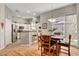 Bright dining area with hardwood floors and sliding door to patio at 130 Twin Towers Ave, Las Vegas, NV 89123