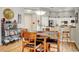Cozy dining area featuring wood table, chairs and nearby kitchen at 130 Twin Towers Ave, Las Vegas, NV 89123