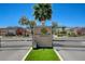 Central Park Estates entrance sign above iron gates, surrounded by lush green landscape at 130 Twin Towers Ave, Las Vegas, NV 89123