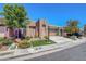 Attractive single-story home featuring a well-manicured lawn and a charming desert landscape at 130 Twin Towers Ave, Las Vegas, NV 89123
