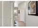 Bright hallway with tile floors leads to the bathroom, creating a seamless transition at 130 Twin Towers Ave, Las Vegas, NV 89123