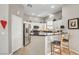 Bright kitchen with stainless steel appliances, breakfast bar, and white cabinets at 130 Twin Towers Ave, Las Vegas, NV 89123