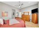 Spacious main bedroom featuring warm wood floors, a neutral palette, and a serene atmosphere at 130 Twin Towers Ave, Las Vegas, NV 89123