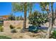 Park bench near custom wall with flowering shrubbery and desert landscaping at 130 Twin Towers Ave, Las Vegas, NV 89123