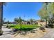Neighborhood park with shade structures, playground, lawn, and greenery at 130 Twin Towers Ave, Las Vegas, NV 89123