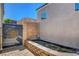 Charming courtyard pond with a decorative brick border and a gold knights symbol at 130 Twin Towers Ave, Las Vegas, NV 89123