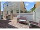 Outdoor patio with brick pavers, grill and charming wicker furniture at 1316 Oak Village Ave, Las Vegas, NV 89183