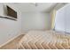 Comfortable bedroom featuring neutral tones, ceiling fan, and a flat-screen TV at 1316 Oak Village Ave, Las Vegas, NV 89183