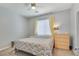 Cozy bedroom featuring a ceiling fan and ample natural light at 1316 Oak Village Ave, Las Vegas, NV 89183