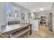 Dining area with table, bench seating, and kitchen views at 1316 Oak Village Ave, Las Vegas, NV 89183