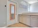 Upstairs hallway with built in cabinets and mirror hanging on door at 1316 Oak Village Ave, Las Vegas, NV 89183