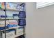 Organized linen closet with shelves filled with towels and household supplies at 1316 Oak Village Ave, Las Vegas, NV 89183